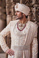 Cream Embroidered Sherwani with Anarkali Silk Kurta and Cream Churidaar.