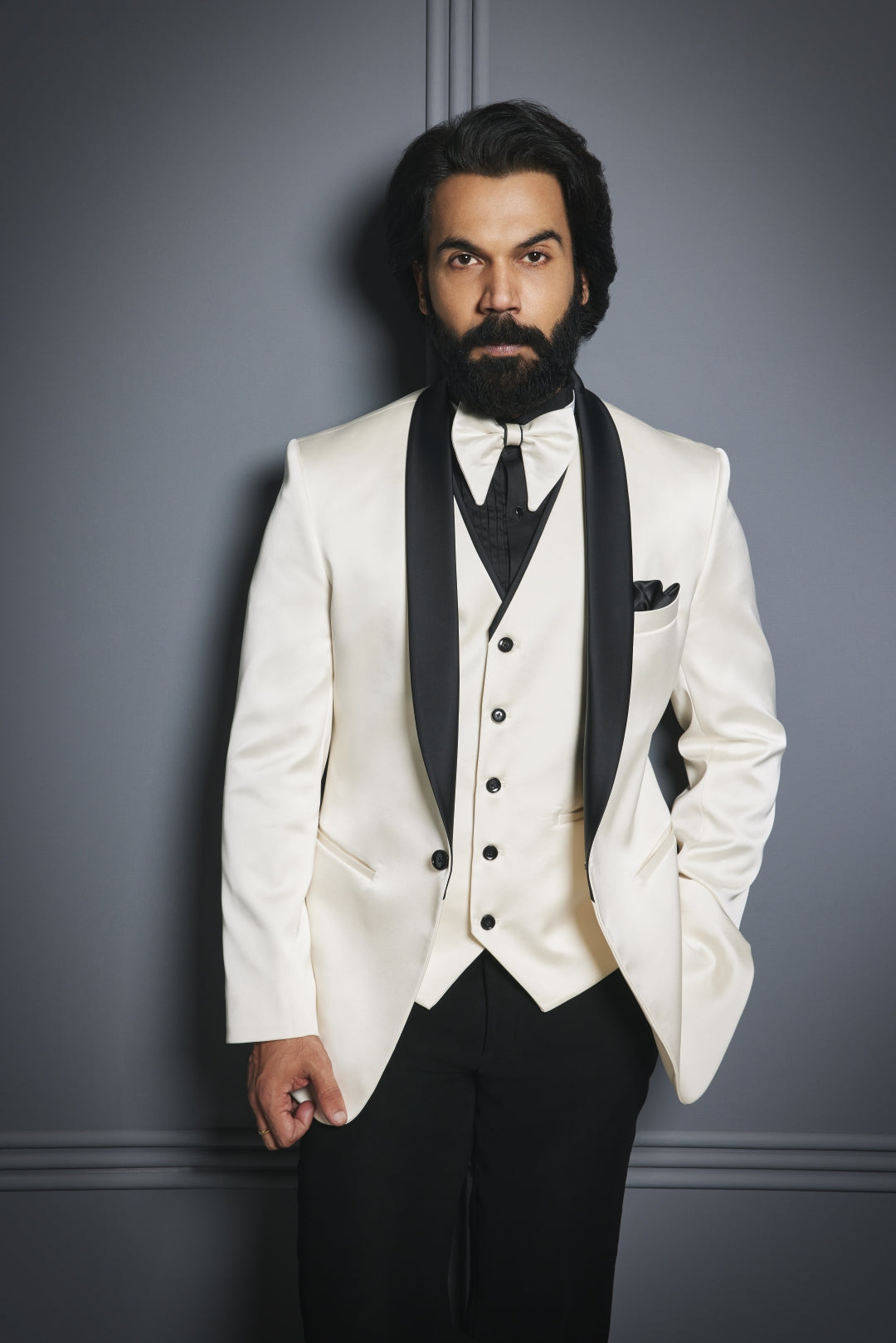 Cream satin tuxedo paired with black trousers for a timeless