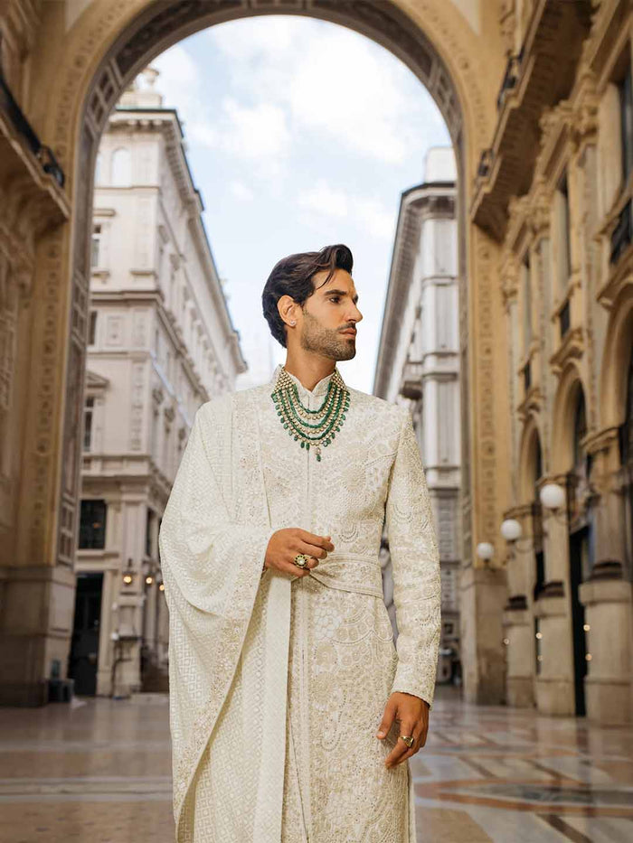 Cream silk embroidered sherwani set for men with kurta, stole, kamarbandh and churidar – front view