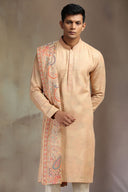 Peach Pashmina Silk Kurta Set with elegant print and flowing dupatta.