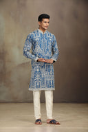 Blue Silk kurta set with a refined blend of print and embroidery.