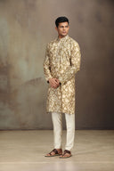 A mustard silk kurta set with a stylish blend of print and intricate embroidery.