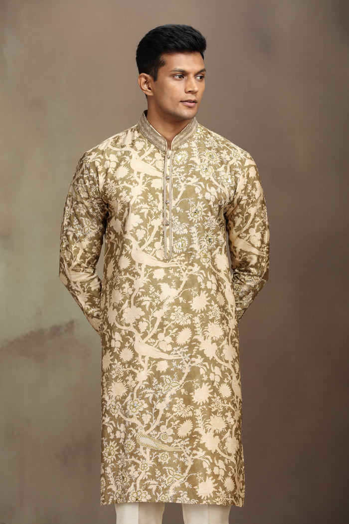 A mustard silk kurta set with a stylish blend of print and intricate embroidery. - KORANM