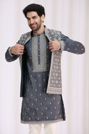 Close-up of geometric embroidery with zari work on grey tissue silk bandi jacket