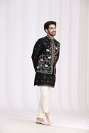 Side view of black satin linen bandi jacket with geometric embroidery and resham work for men