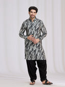 Styled Eid look of black raw silk leheriya pathani kurta set for men