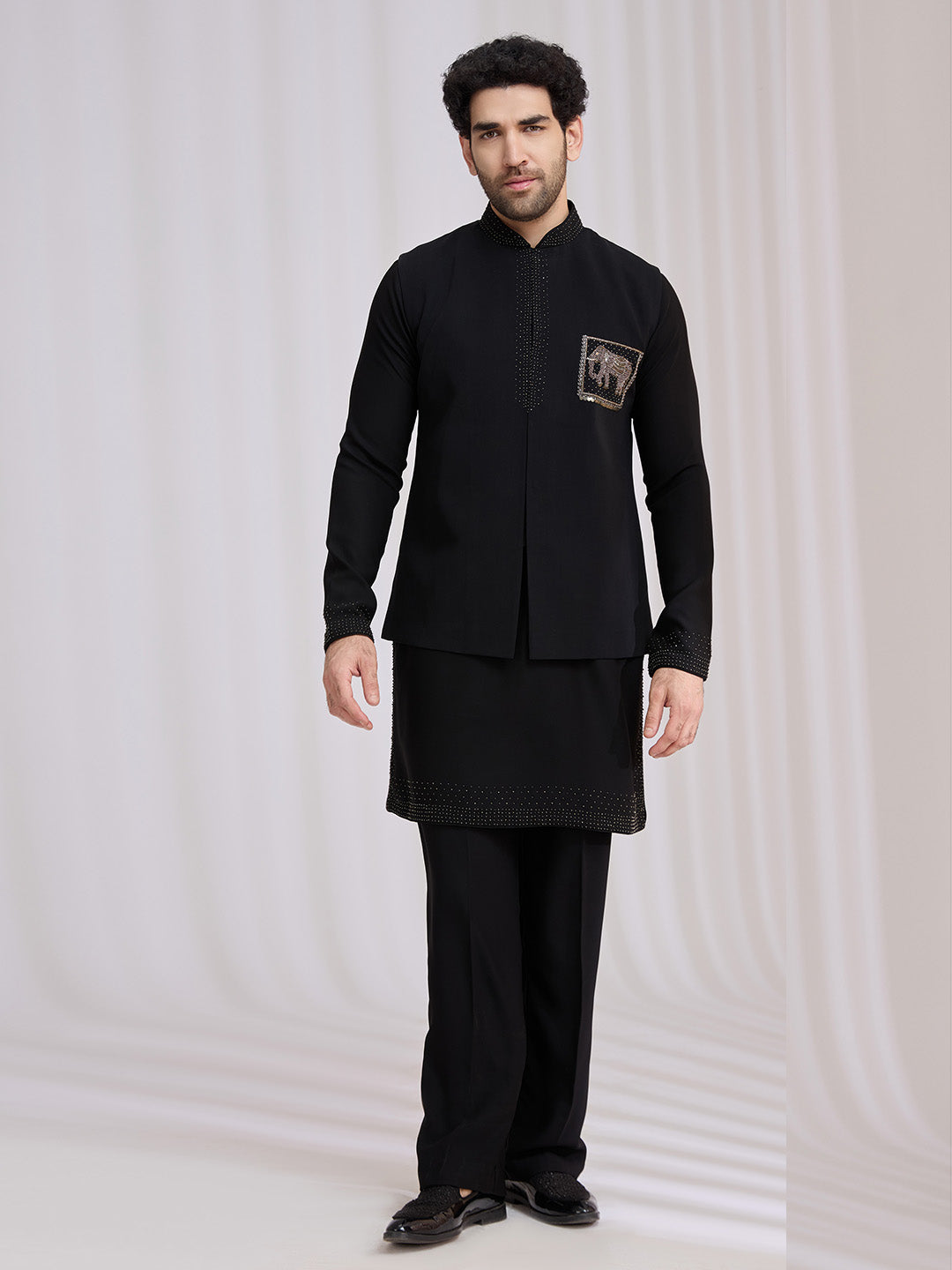 Styled sangeet look of black terry rayon bandi jacket set for men with kurta and aligarhi