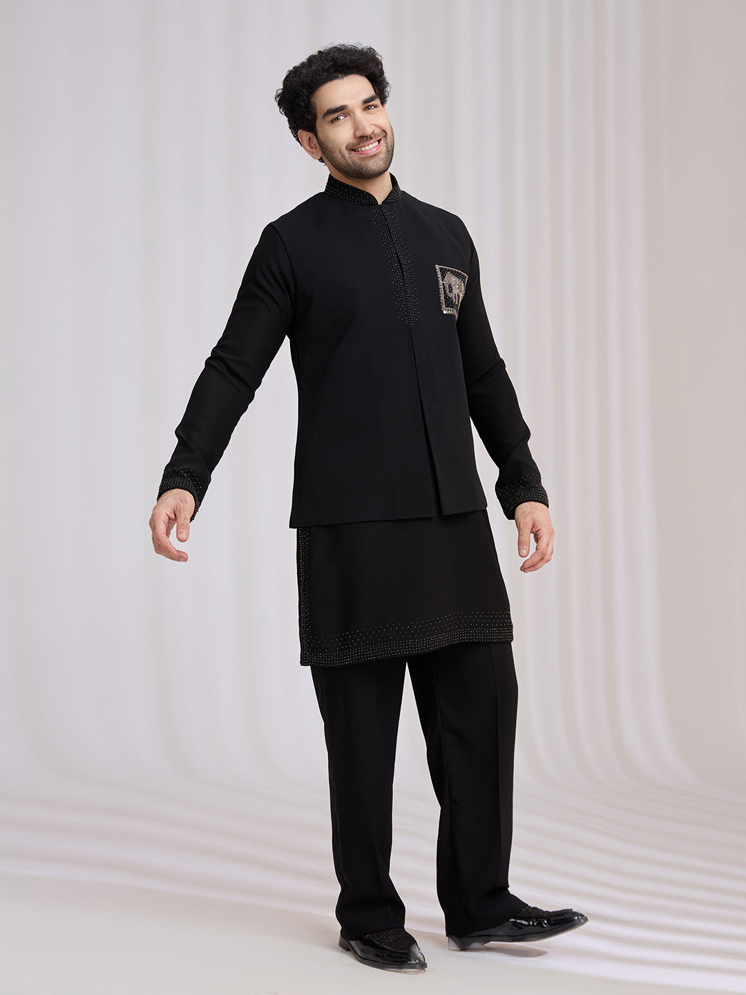 Styled sangeet look of black terry rayon bandi jacket set for men with kurta and aligarhi