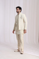 Close-up of floral embroidery on cream Indo-Western kurta for men