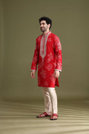 Side view of red blended silk floral kurta set for men