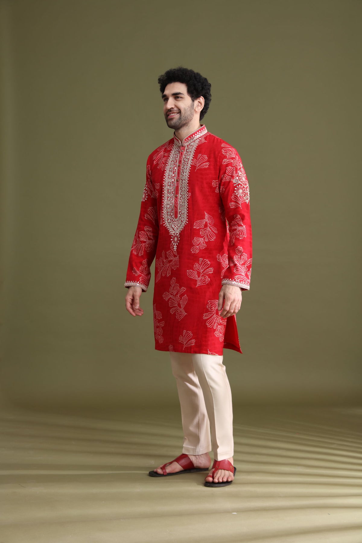 Side view of red blended silk floral kurta set for men