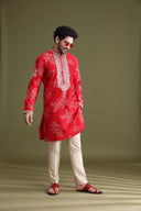 Close-up of floral print and mirror work on red blended silk kurta for men