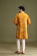 Back view of mustard blended silk floral kurta set for men