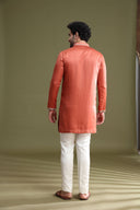 Back view of rust satin linen kurta set for men