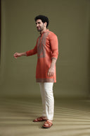 Side view of rust satin linen kurta set for men with Chinese collar