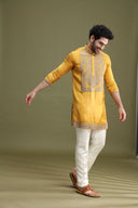 Styled festive look of yellow satin linen kurta set for men with cream aligarhi