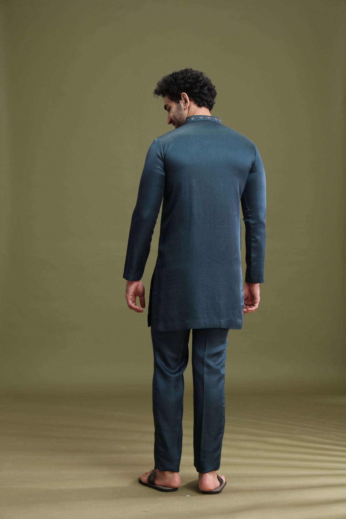 Back view of rama green satin linen kurta set for men