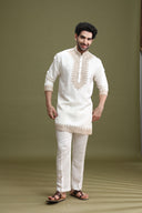 Close-up of dori embroidery on white short kurta for men