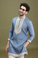 Blue linen short kurta set for men with cream aligarhi and dori embroidery – front view