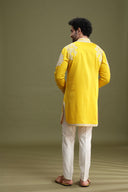 Back view of yellow short kurta set for men