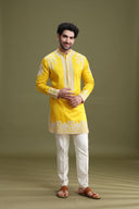 Styled haldi look of yellow short kurta set for men with aligarhi