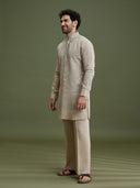 Side view of khaki linen silk kurta for men with mandarin collar and dori embroidery