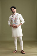 Styled festive look of cream blended silk kurta set for men with aligarhi