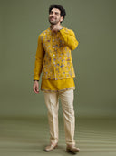 Close-up of floral embroidery with zari work on yellow bandi jacket