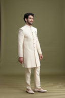 Side view of cream Lucknowi Indo-Western sherwani for men with Chinese collar