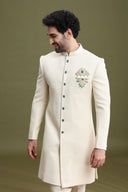 Cream Lucknowi Indo-Western sherwani set for men with zardozi poth hand embroidery and pants – front view
