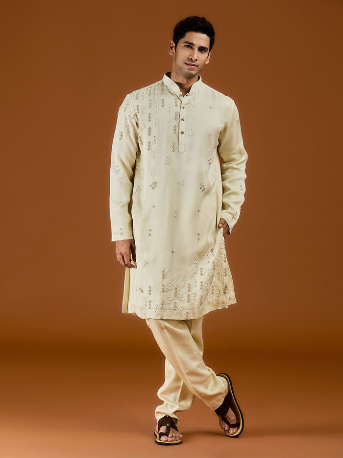 Pista satin linen blend kurta set featuring delicate thread embroidery and a coordinated pista bottom. - KORANM