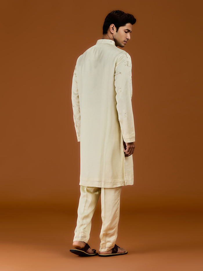 Pista satin linen blend kurta set featuring delicate thread embroidery and a coordinated pista bottom. - KORANM