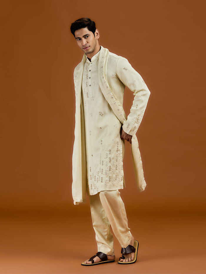 Pista satin linen blend kurta set featuring delicate thread embroidery and a coordinated pista bottom. - KORANM
