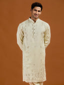 Pista satin linen blend kurta set featuring delicate thread embroidery and a coordinated pista bottom.