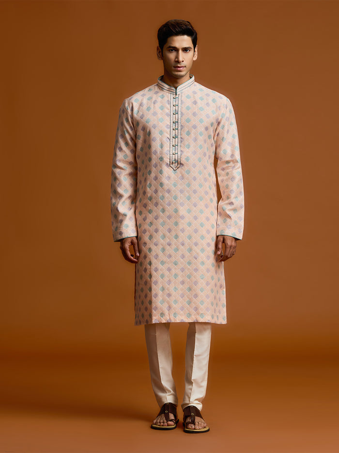 Peach silk-jacquard kurta set with all-over geometric diamond print, paired with a cream bottom. - KORANM