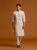 Peach silk-jacquard kurta set with all-over geometric diamond print, paired with a cream bottom. - KORANM
