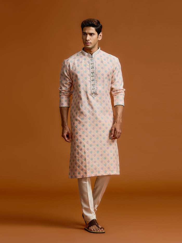 Peach silk-jacquard kurta set with all-over geometric diamond print, paired with a cream bottom. - KORANM