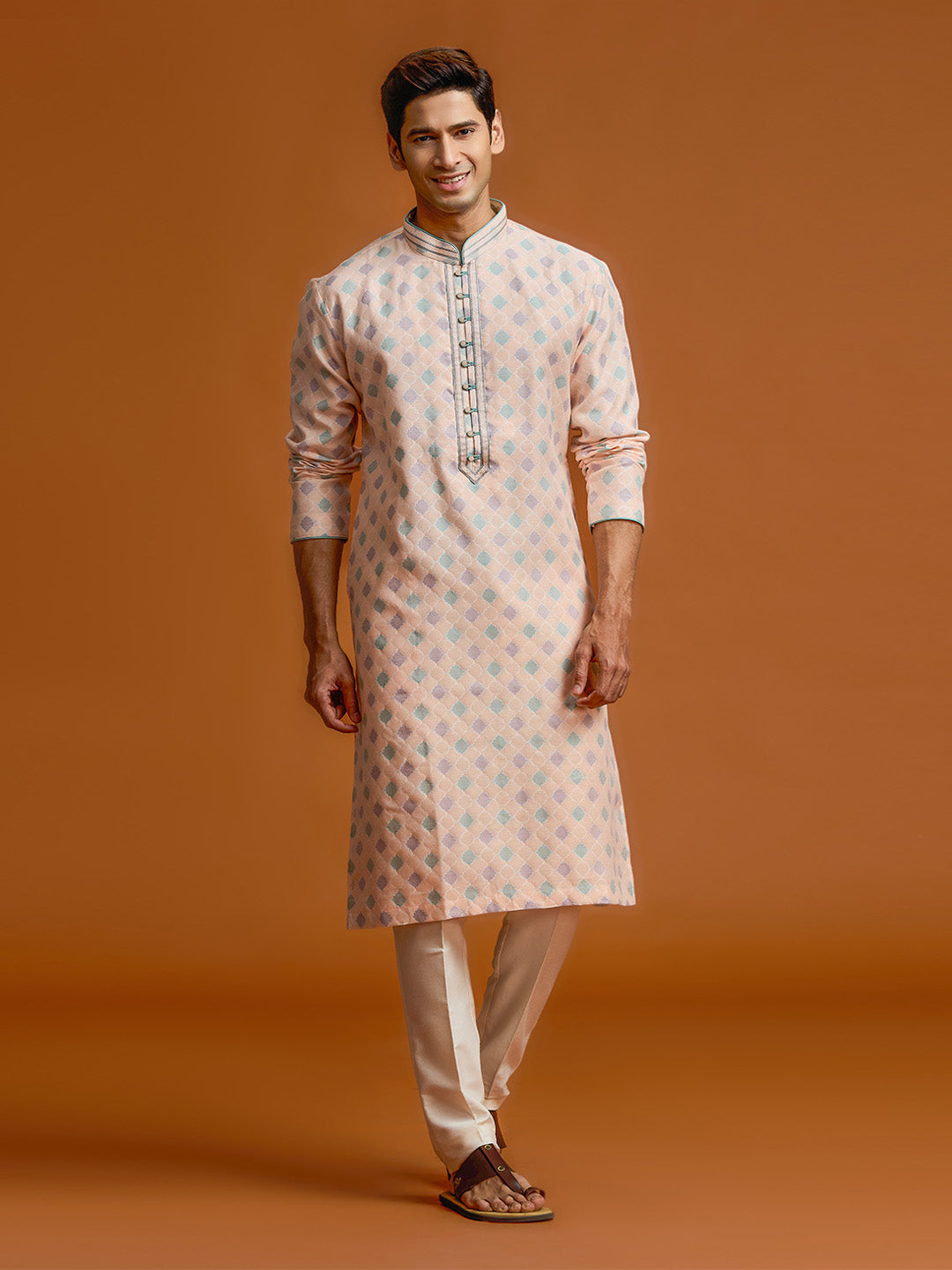 Peach silk-jacquard kurta set with all-over geometric diamond print, paired with a cream bottom. - KORANM