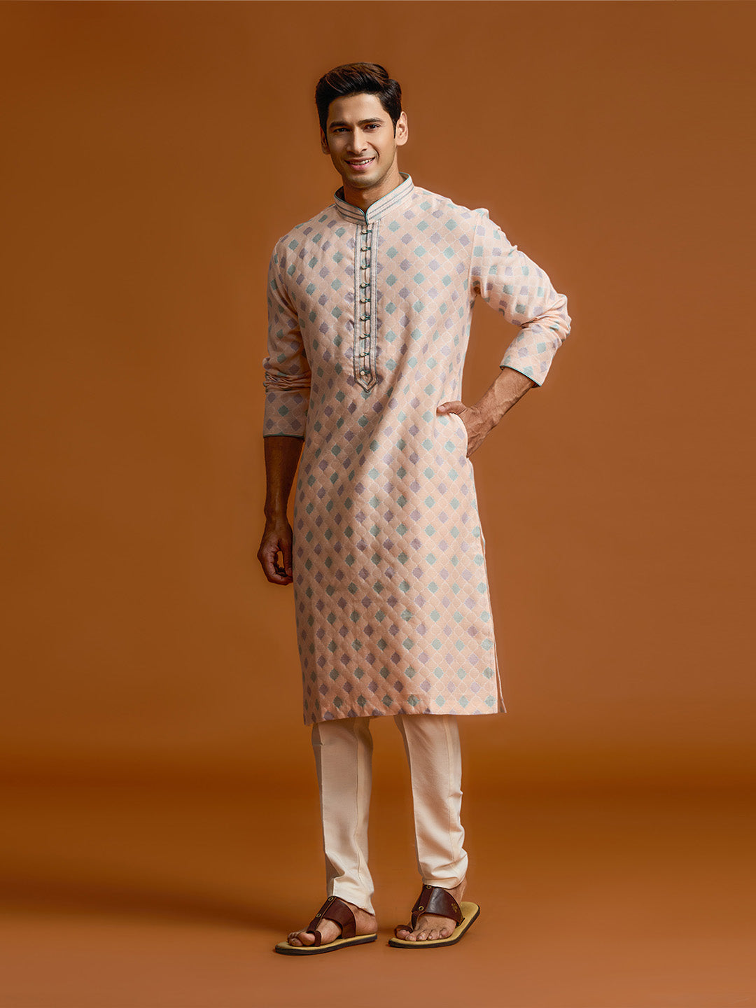 Peach silk-jacquard kurta set with all-over geometric diamond print, paired with a cream bottom. - KORANM