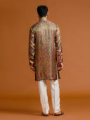Olive Jamawar kurta, paired with a white bottom.