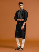Elegant Black Silk Kurta Featuring Mirror-Work Embroidery Paired with White Bottoms. - KORANM
