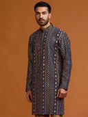 Navy blue kurta with architectural print, dense tonal threadwork, and subtle shimmer, paired with antique gold Aligarh pants.