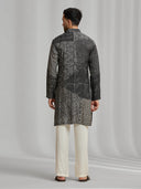 Black and cream silk-blend kurta featuring a multi-patterned geometric design with white bottoms. - KORANM