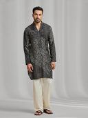 Black and cream silk-blend kurta featuring a multi-patterned geometric design with white bottoms. - KORANM
