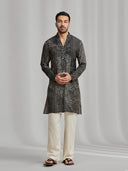 Black and cream silk-blend kurta featuring a multi-patterned geometric design with white bottoms. - KORANM