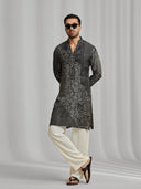 Black and cream silk-blend kurta featuring a multi-patterned geometric design with white bottoms. - KORANM