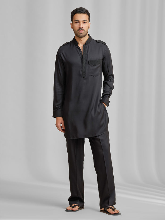 Black silk kurta set with subtle matching embroidery, paired with black bottoms. - KORANM