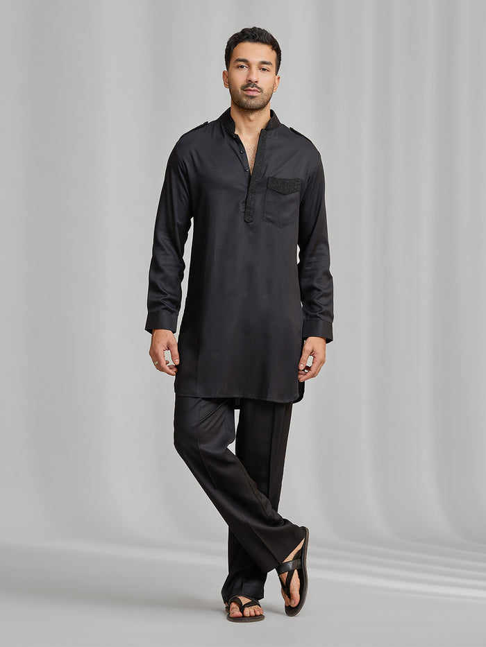 Black silk kurta set with subtle matching embroidery, paired with black bottoms. - KORANM