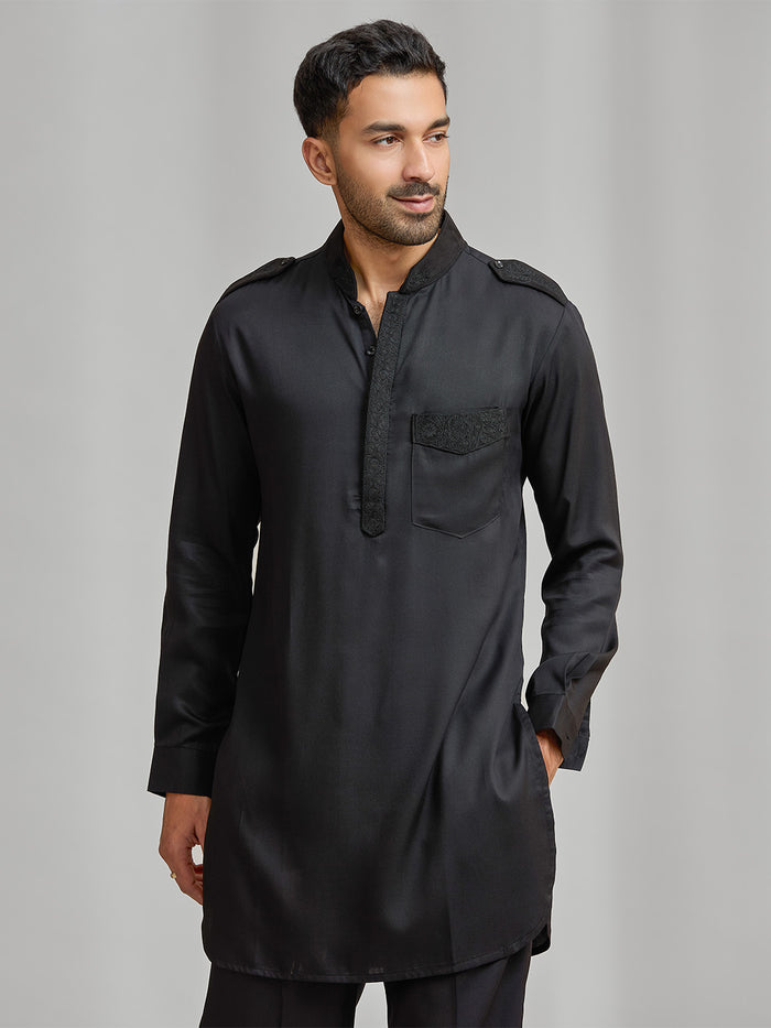 Black silk kurta set with subtle matching embroidery, paired with black bottoms. - KORANM