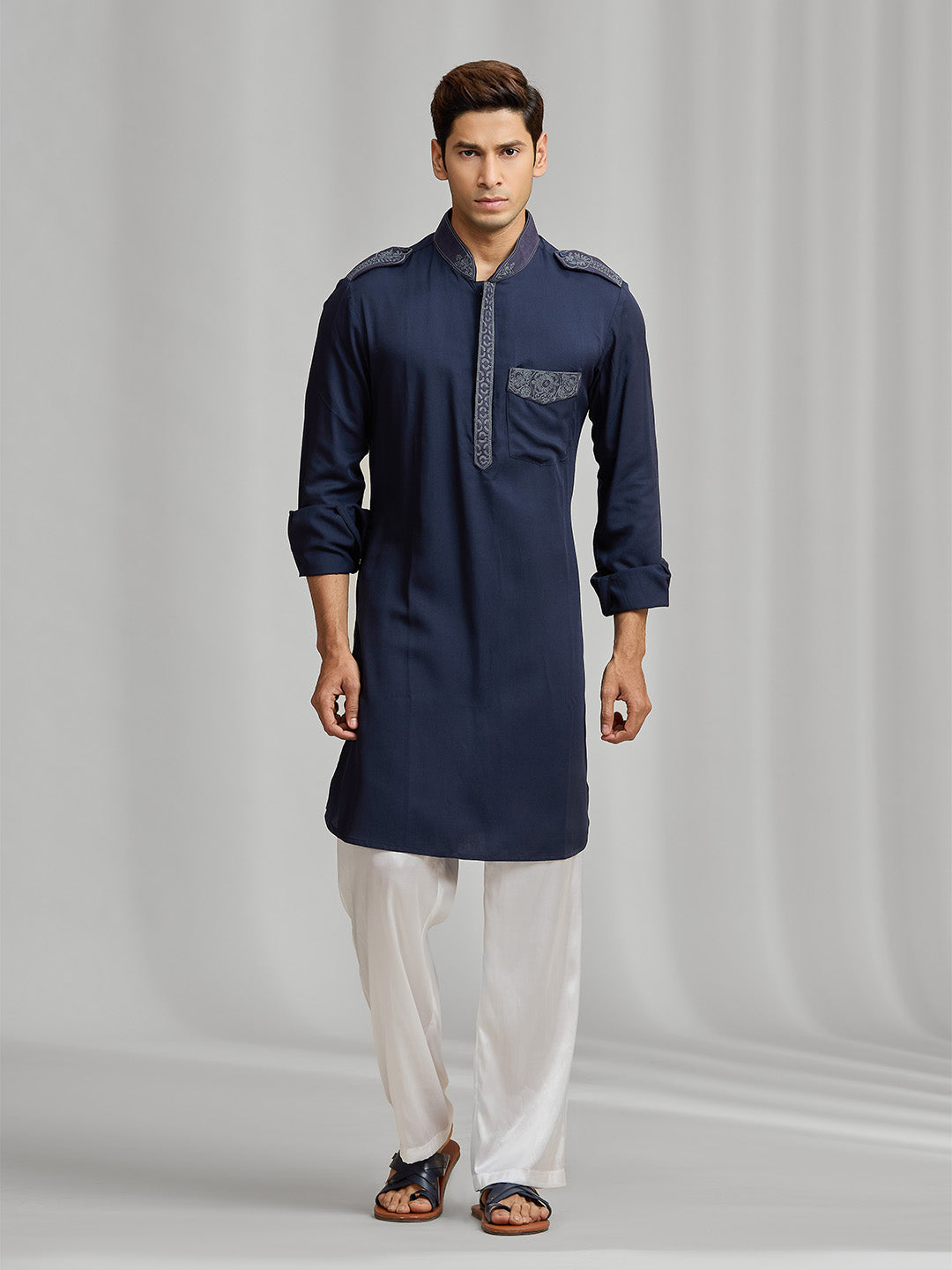 Navy blue silk kurta set with tonal embroidery, paired with white bottoms. - KORANM